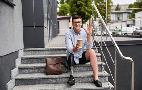 handsome-young-man-with-prosthetic-leg-sitting-on-2024-12-18-02-14-46-utc_2